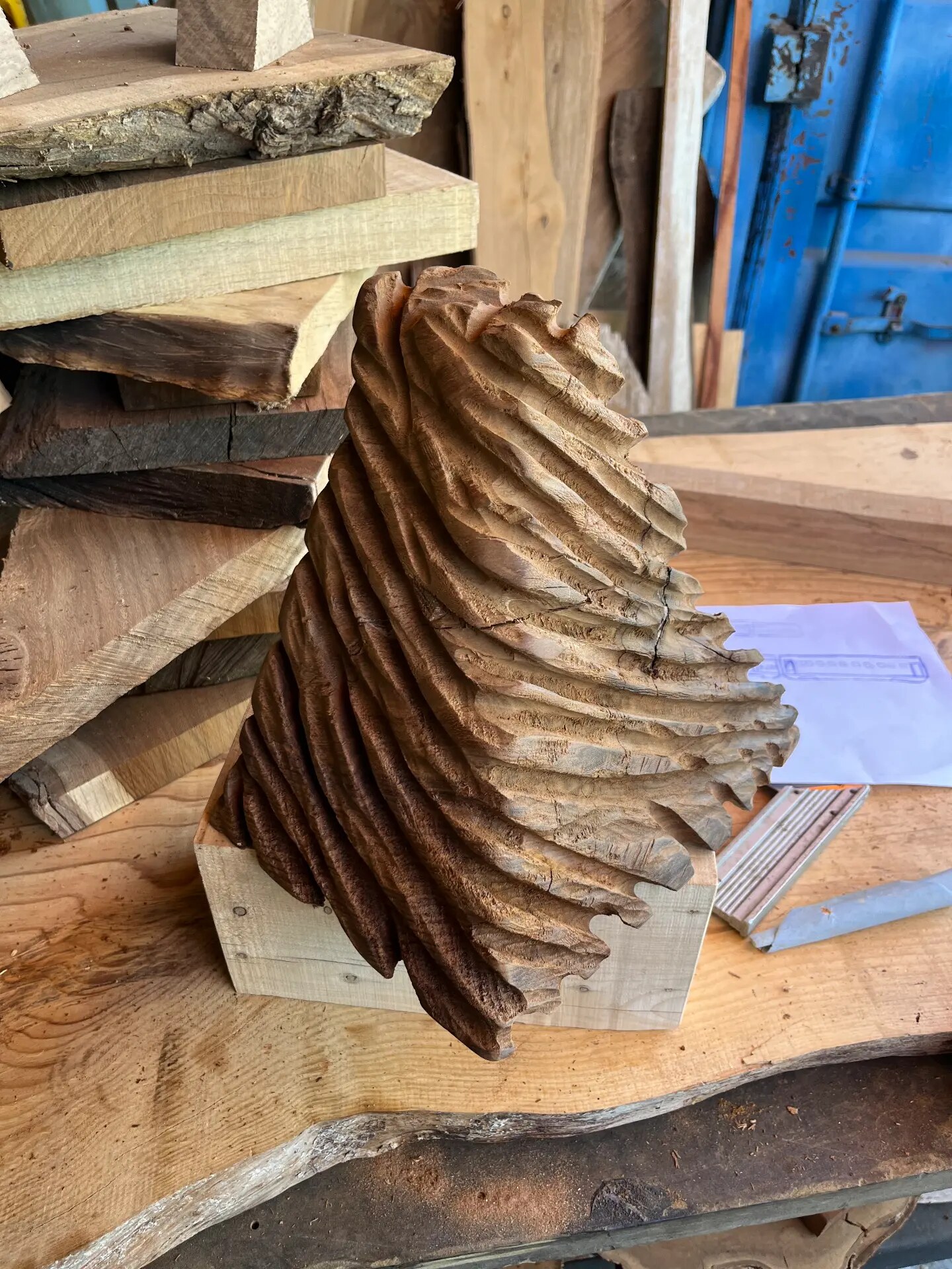 Carved wooden form on the workshop bench